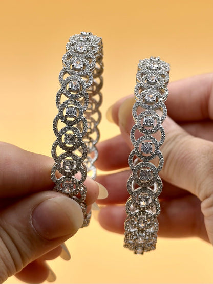 Zircon studded, circular pattern sterling silver bangles