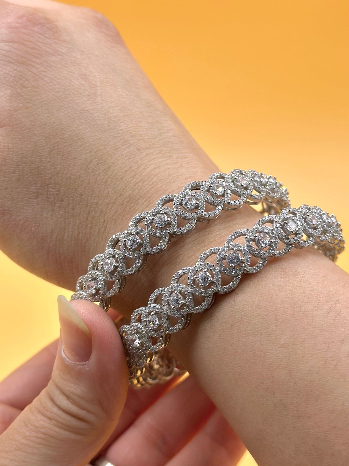 Zircon studded, circular pattern sterling silver bangles