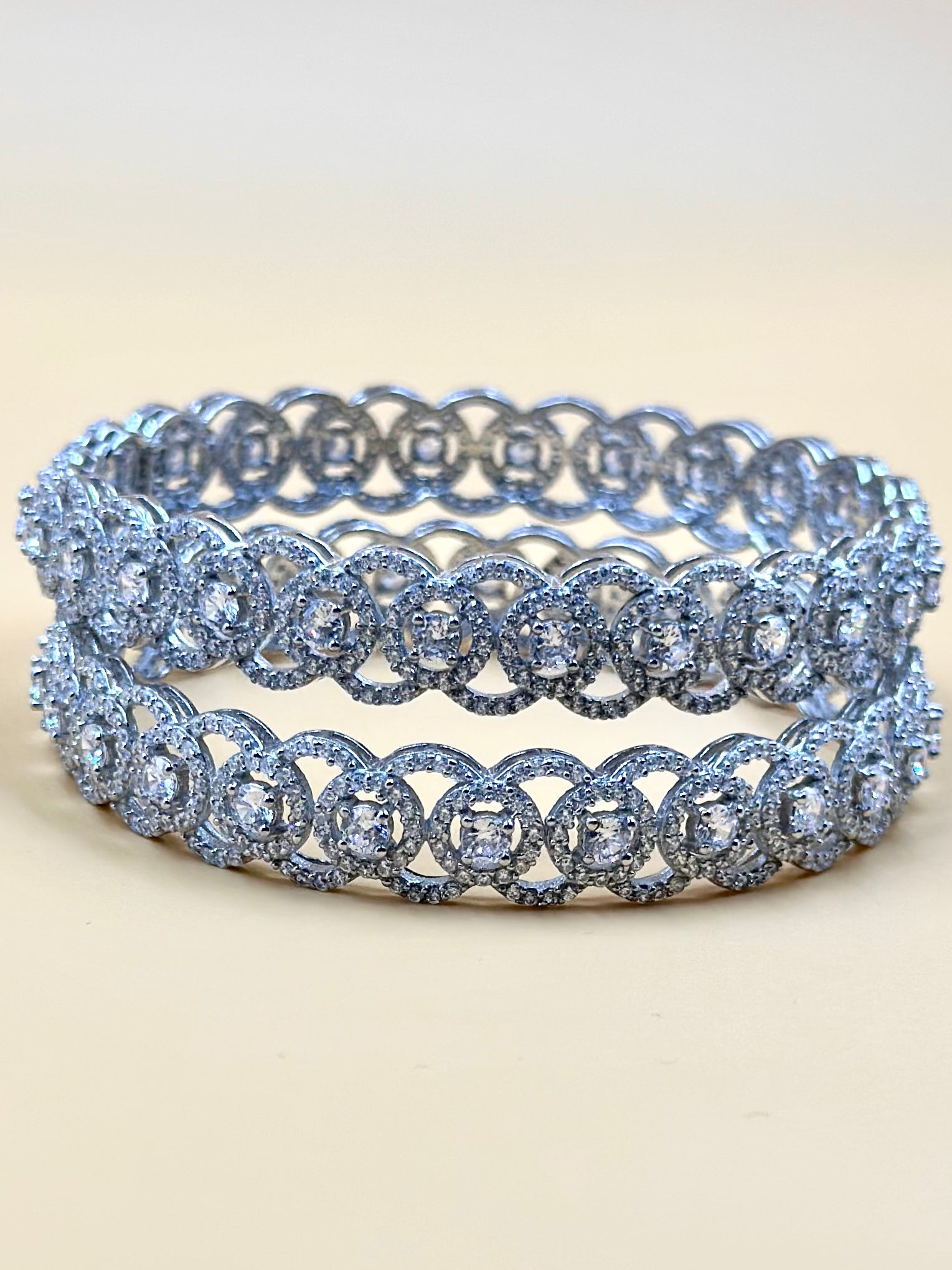 Zircon studded, circular pattern sterling silver bangles