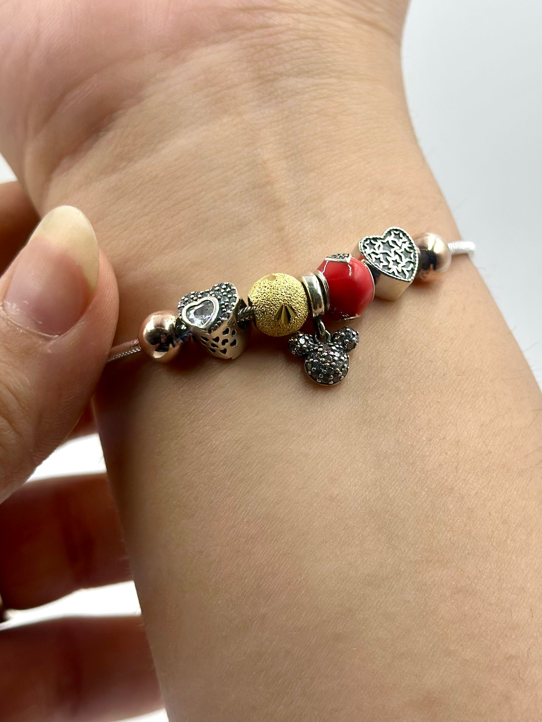 Zircon studded, heart-micky-circle shaped charms sterling silver charm bracelet