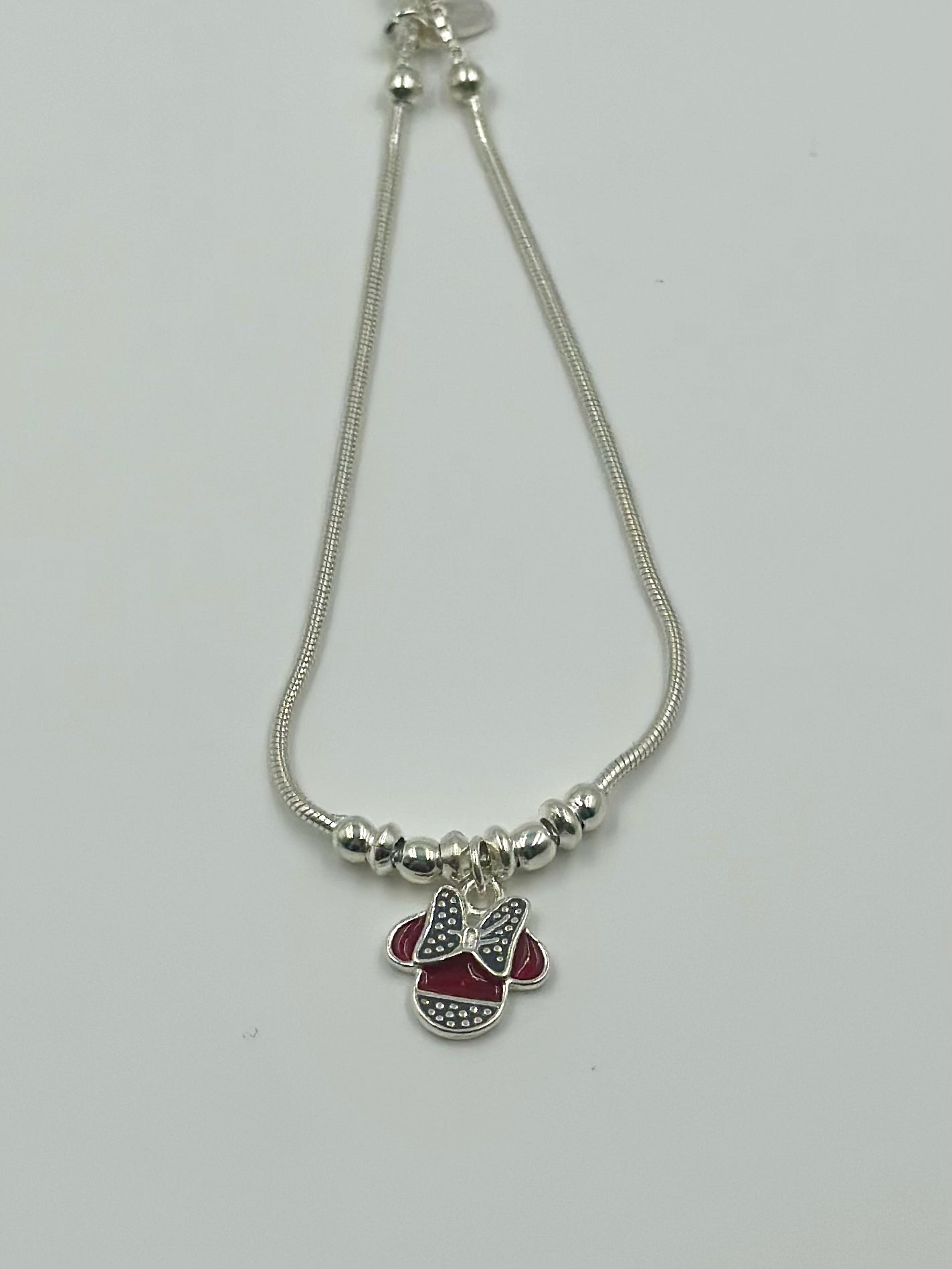 Oxidised, enamel coated sterling silver charm bracelet