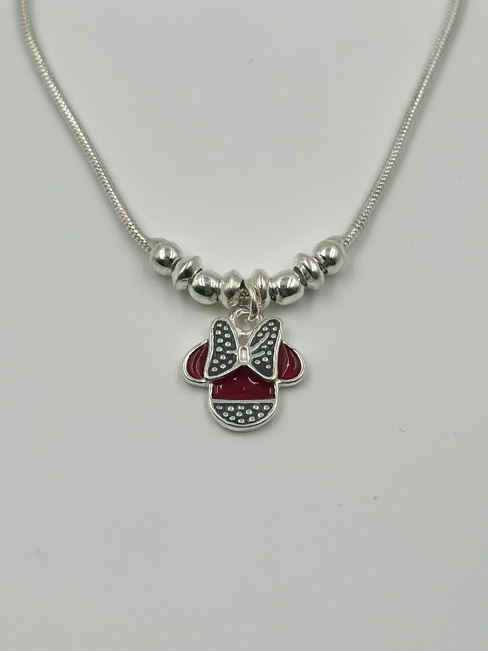 Oxidised, enamel coated sterling silver charm bracelet