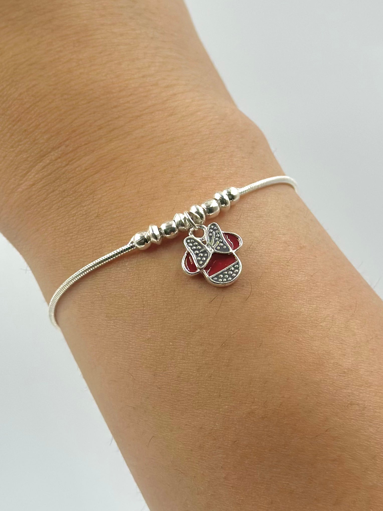 Oxidised, enamel coated sterling silver charm bracelet