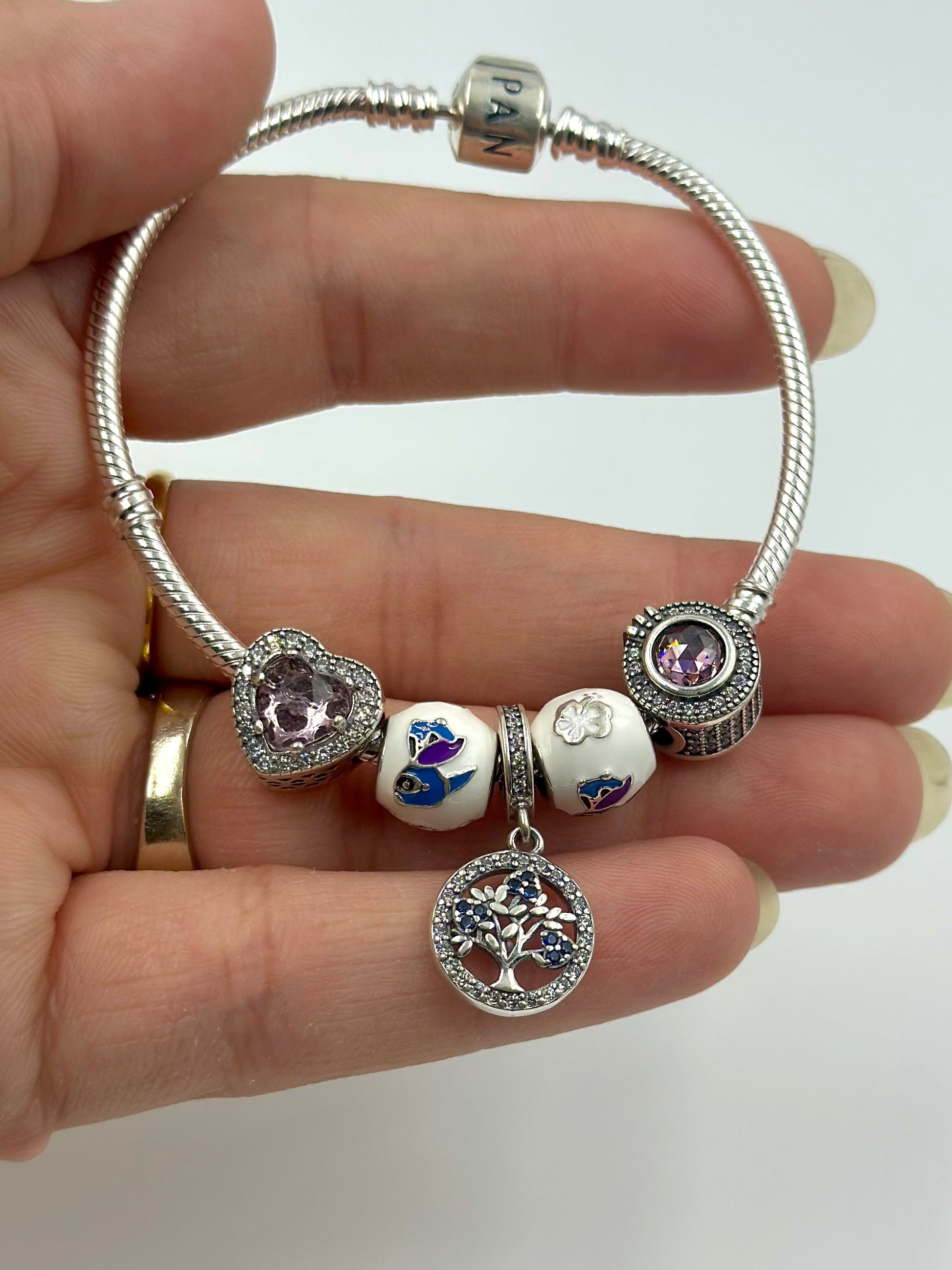 Stone and Zircon studded, enamel coated sterling silver charm bracelet