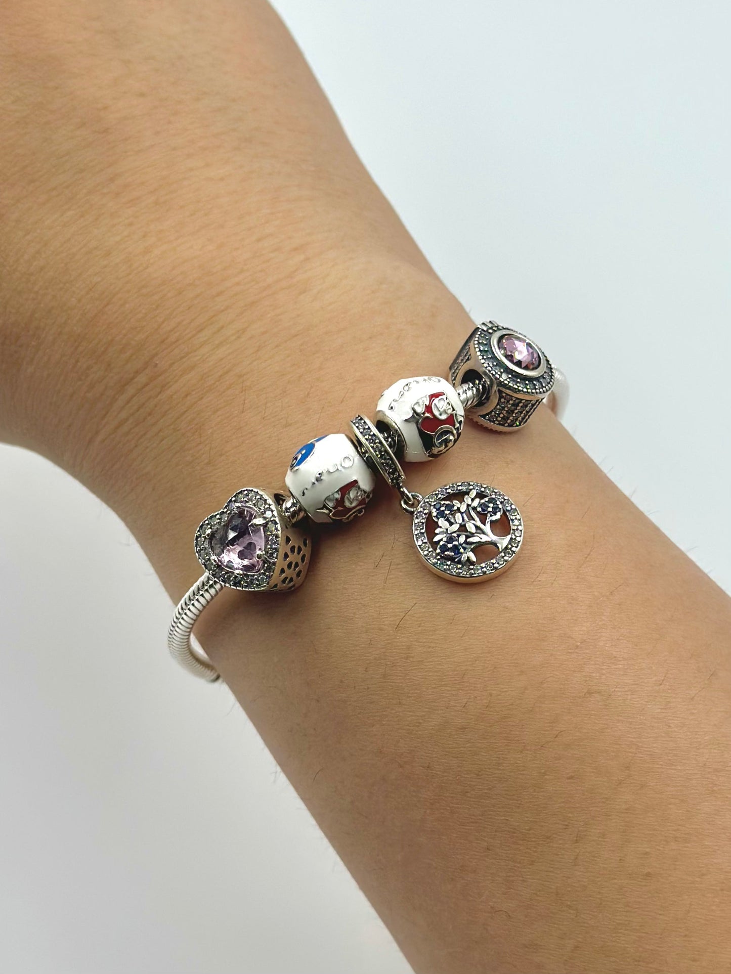Stone and Zircon studded, enamel coated sterling silver charm bracelet