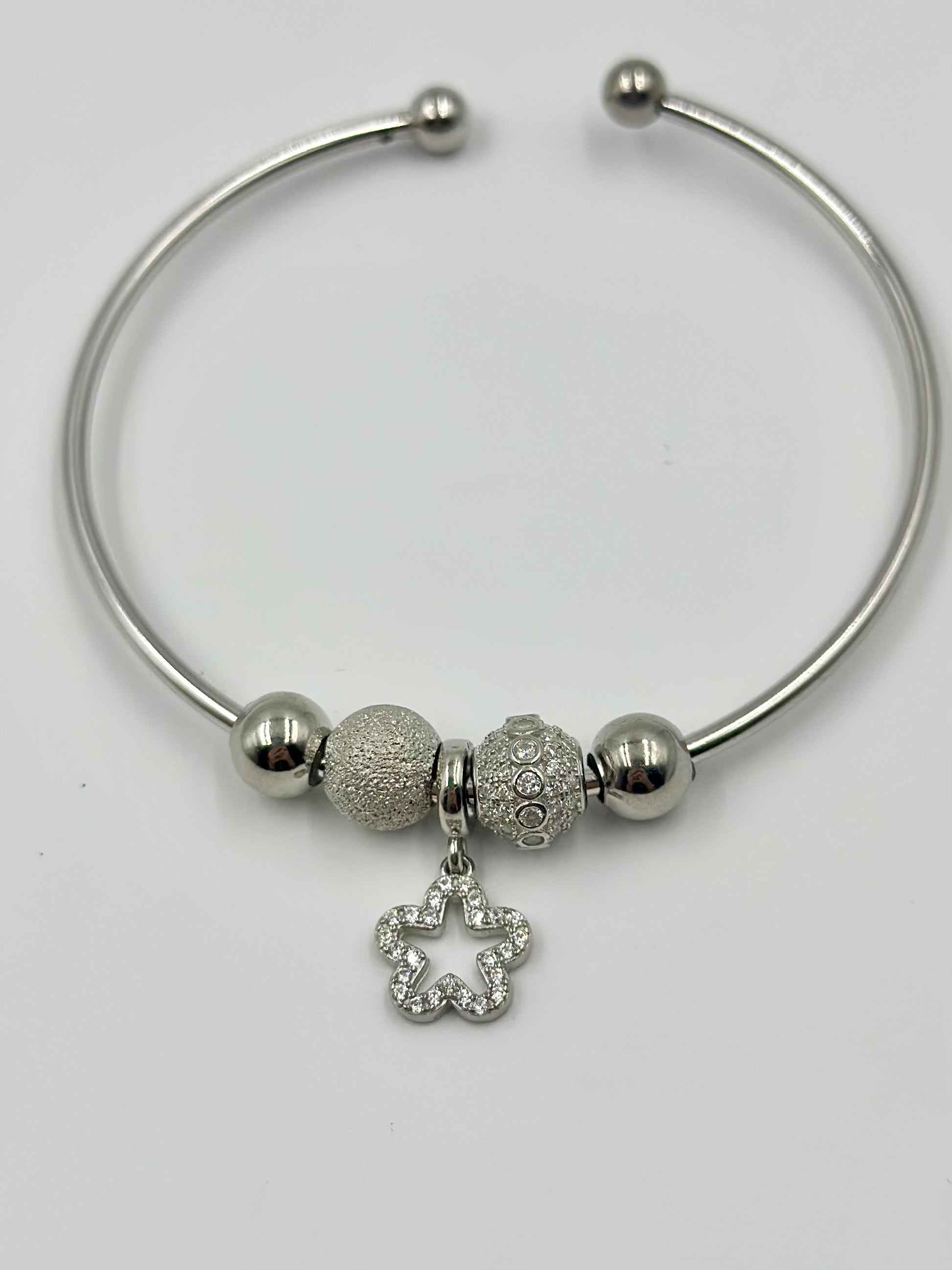 Zircon studded, star-circle shaped sterling silver charm bracelet
