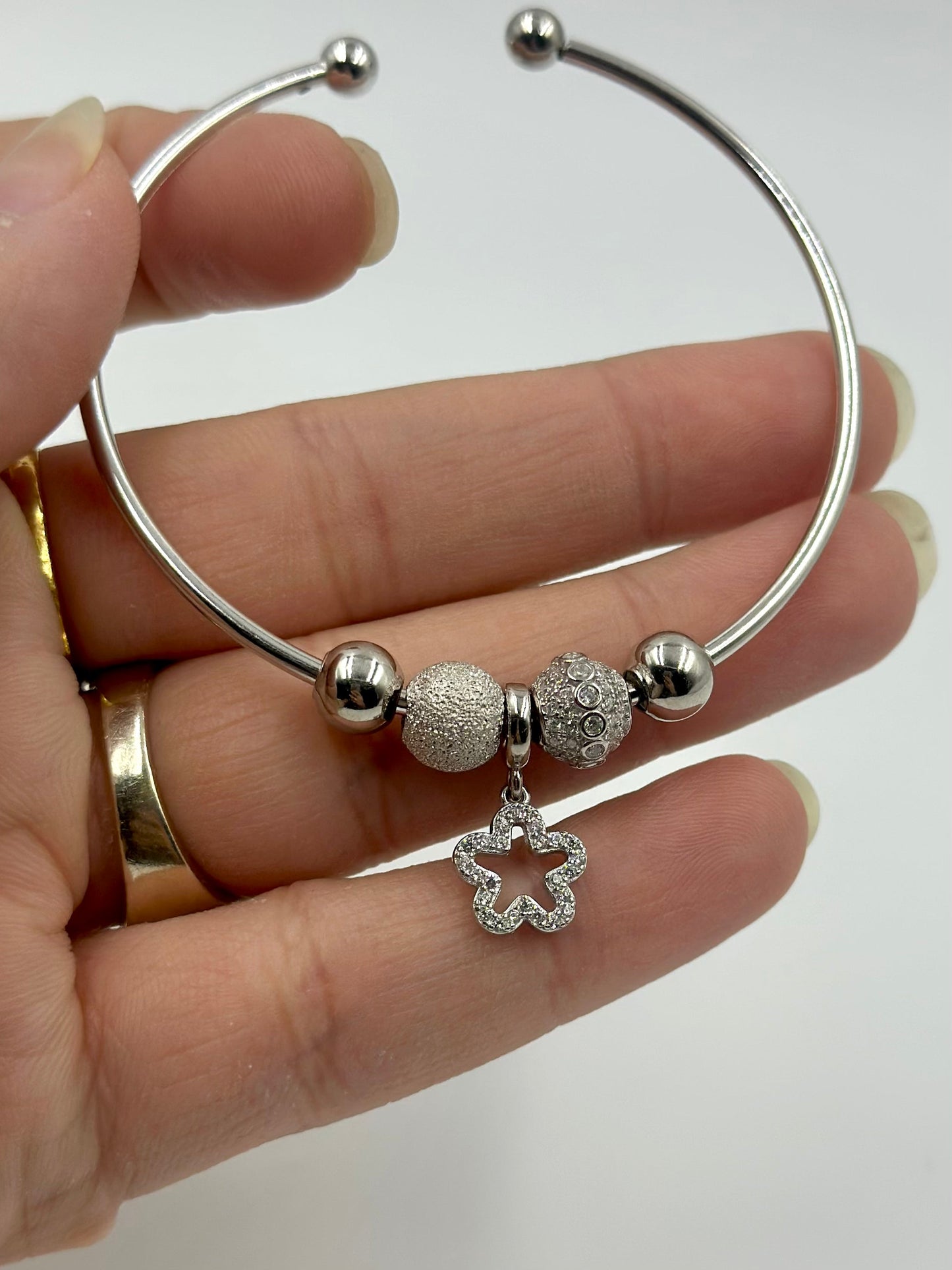 Zircon studded, star-circle shaped sterling silver charm bracelet