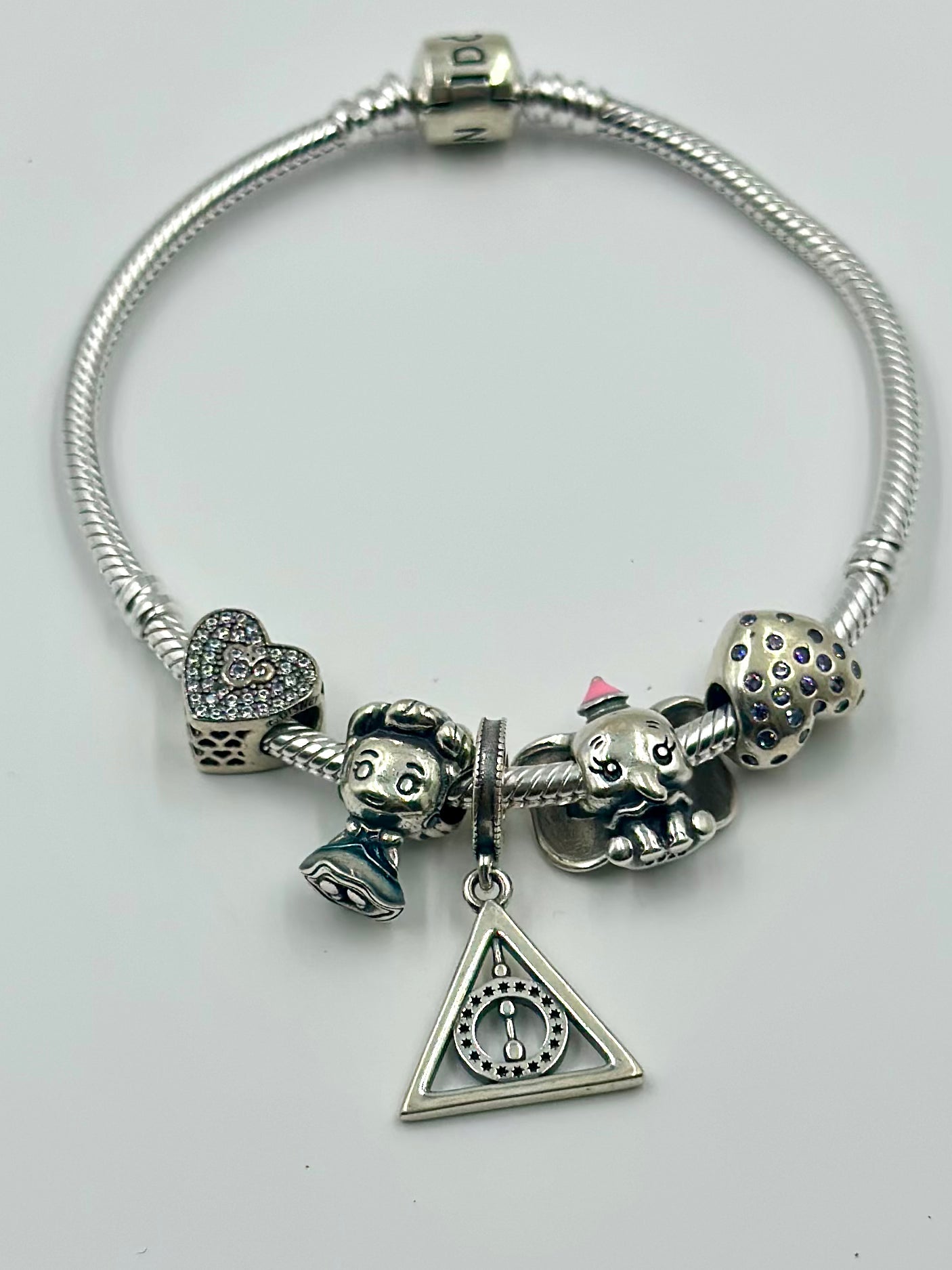 Zircon studded sterling silver charm bracelet