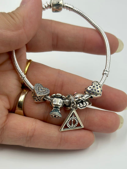 Zircon studded sterling silver charm bracelet