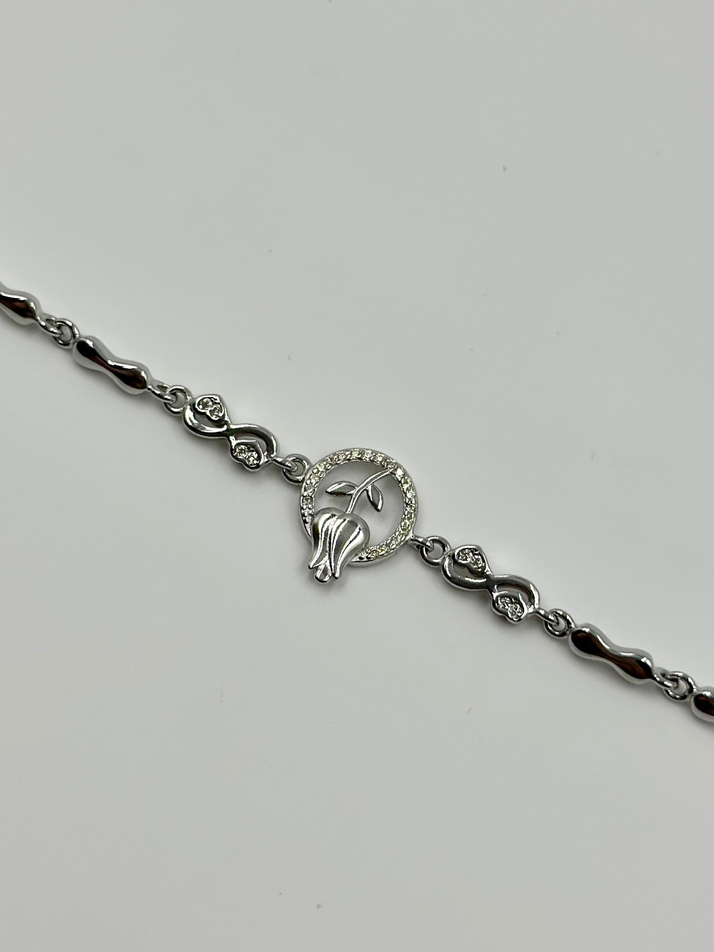 Zircon studded, rose design sterling silver link bracelet