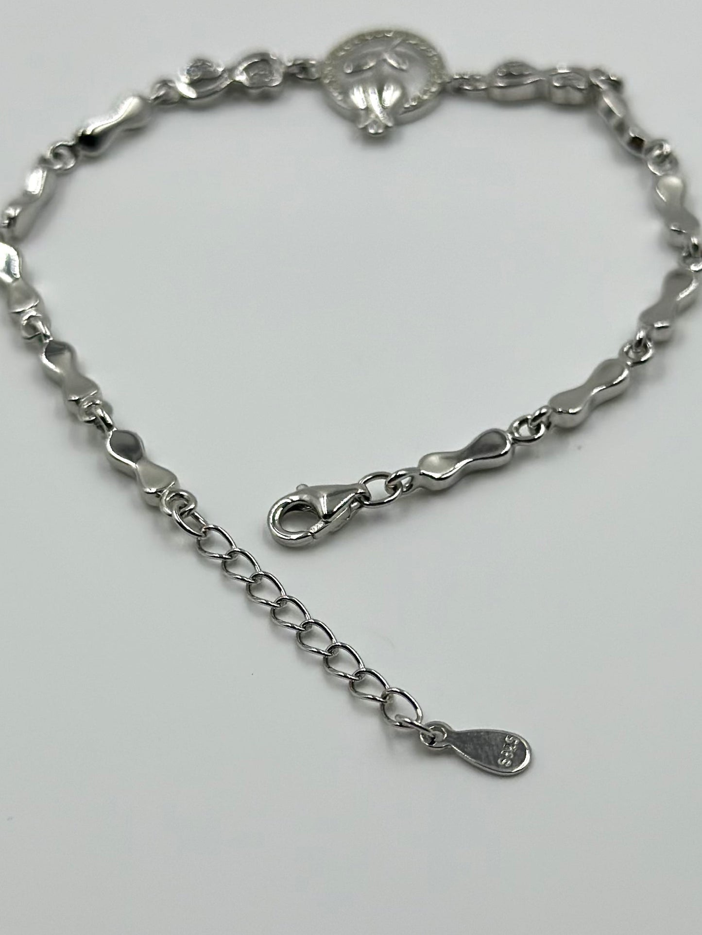 Zircon studded, rose design sterling silver link bracelet