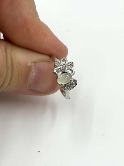 Zircon studded with a green stone, flower shaped sterling silver artisanal ring