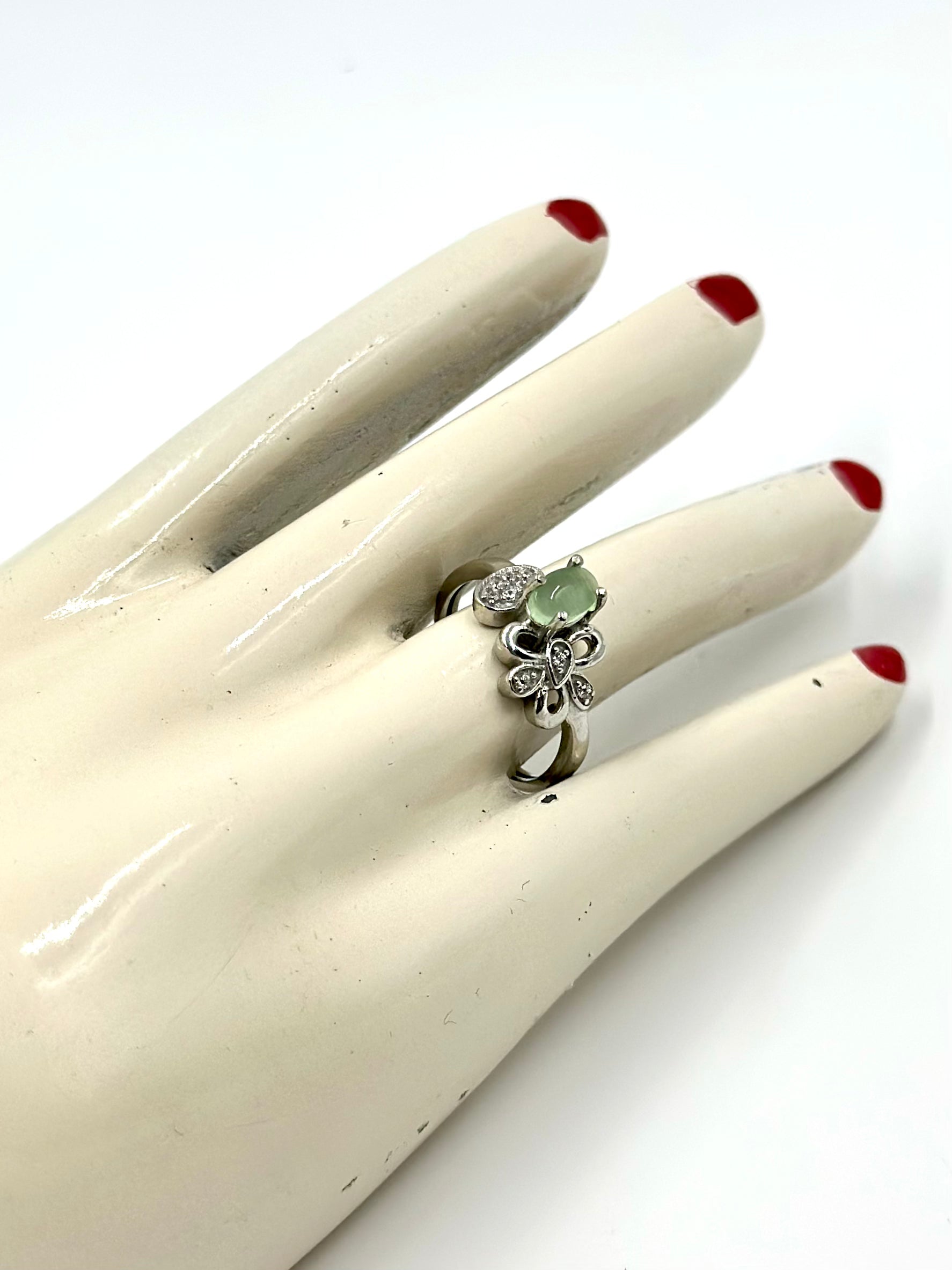 Zircon studded with a green stone, flower shaped sterling silver artisanal ring