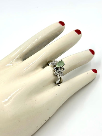 Zircon studded with a green stone, flower shaped sterling silver artisanal ring
