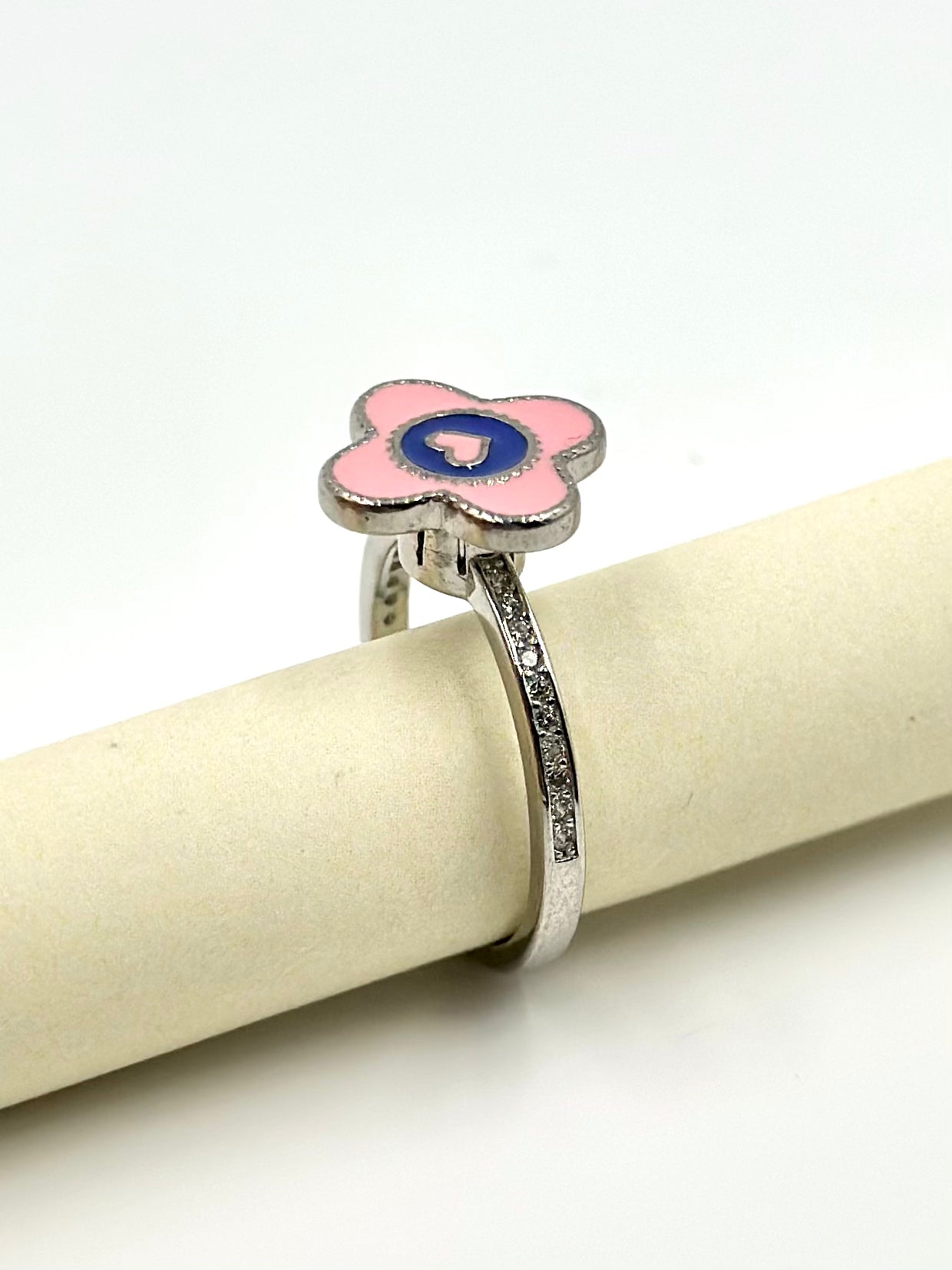 Zircon studded, enamel coated, flower shaped, spinner design sterling silver artisanal ring