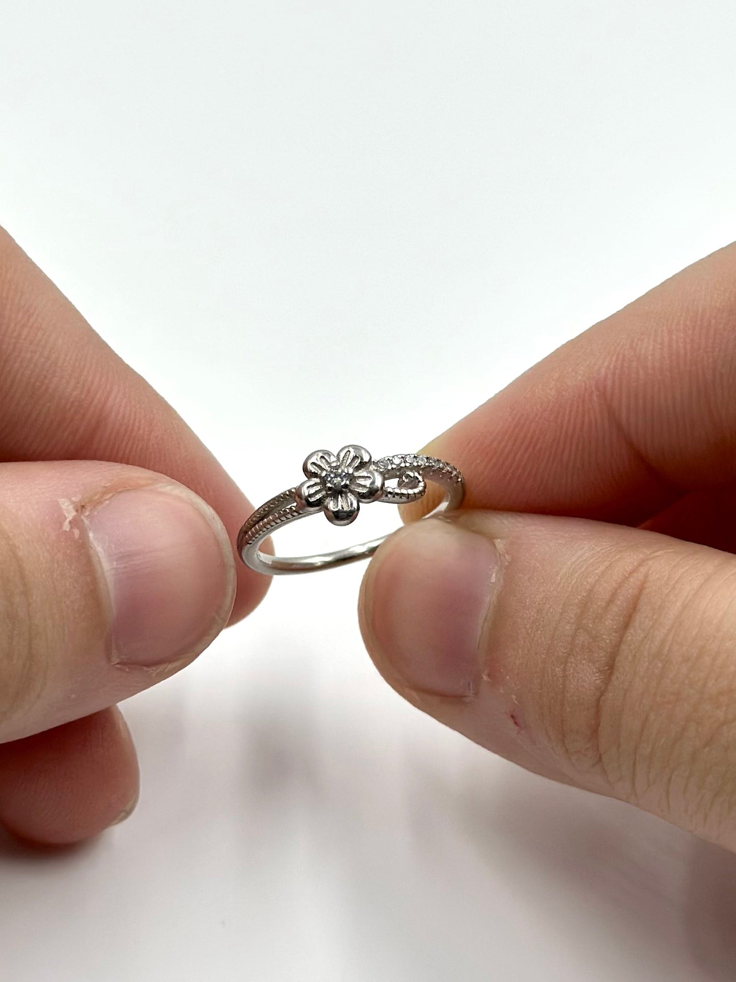 Zircon studded, flower shaped sterling silver artisanal ring