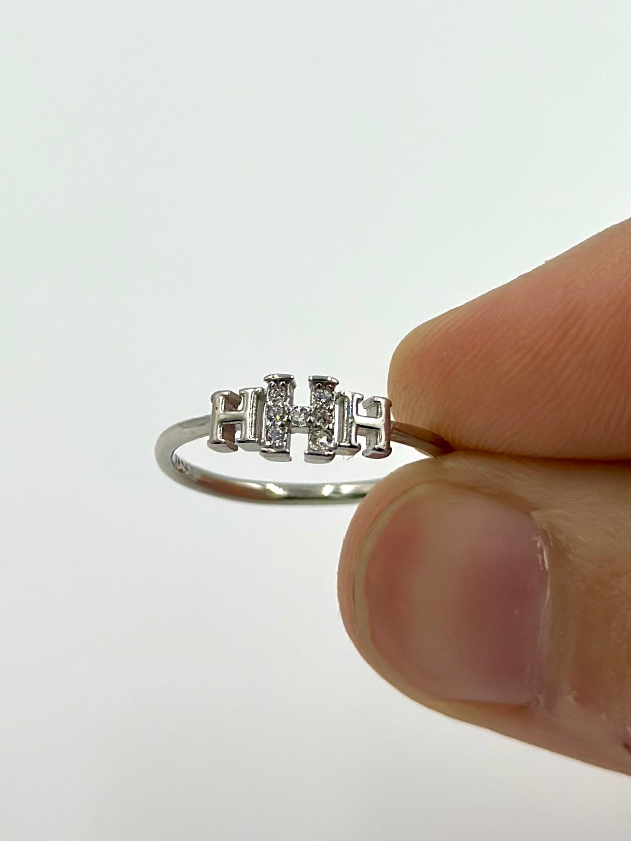 Zircon studded, H shaped sterling silver artisanal ring