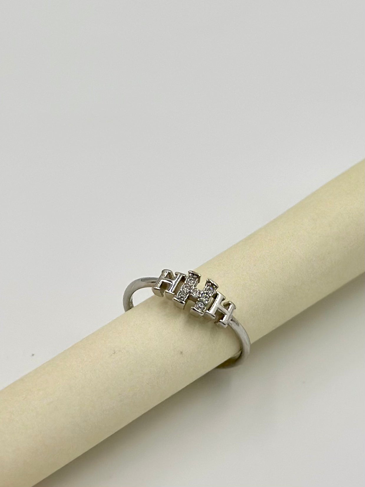 Zircon studded, H shaped sterling silver artisanal ring