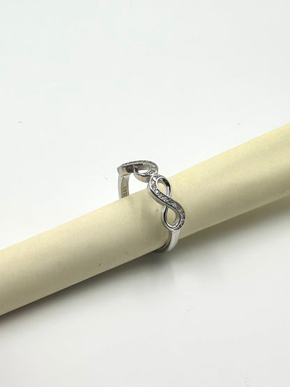 Zircon studded, infinity shaped sterling silver artisanal ring