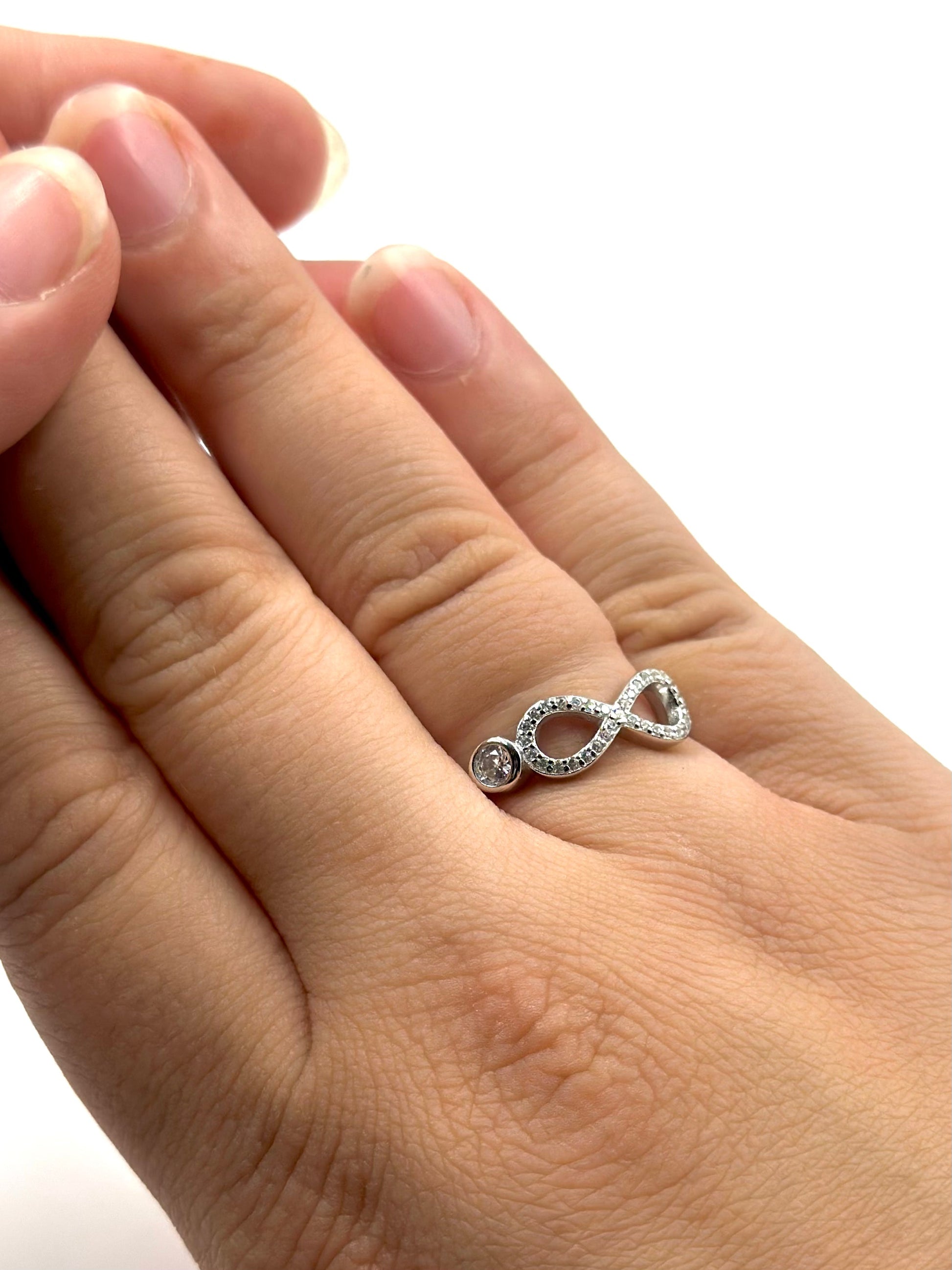 Zircon studded, infinity shaped sterling silver artisanal ring